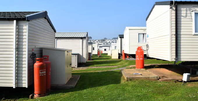 A huge seaside caravan site with outdoor red gas bottles in Exmounth Devon United Kingdom