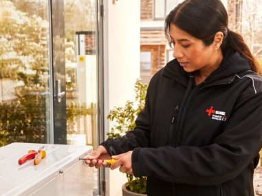 Electrician fixing an appliance